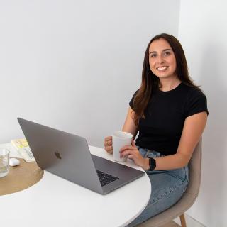 student in front of her laptop at home