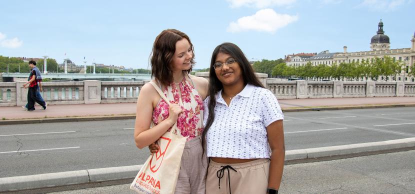 two students on a bridge in Lyon