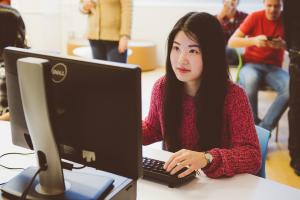 student in front of a computer