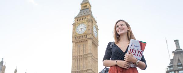 Girl with a brochure in front of Big Ben