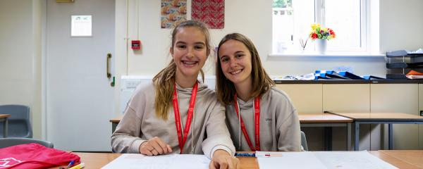 two students in a classroom