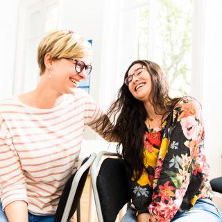 two students laughing together