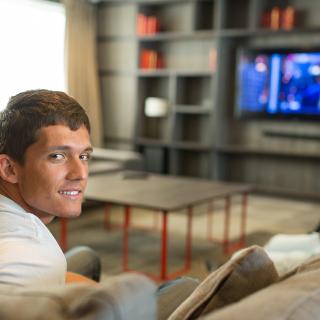 student watching tv in a host family