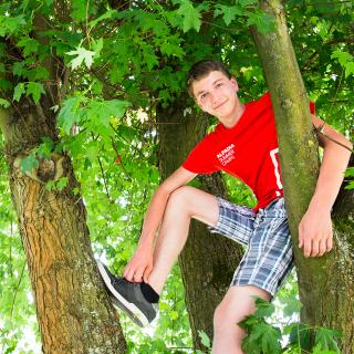 student in a tree