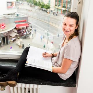 Student working near a window