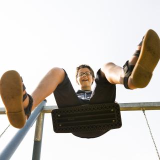 student on a swing